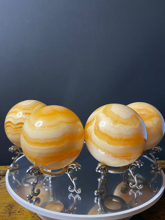 ORANGE CALCITE SPHERES A - D